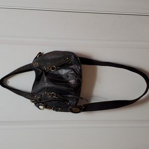 Fossil cross body bag.  Bag is 13 inches wide, 9.5 inches tall. Black leather.